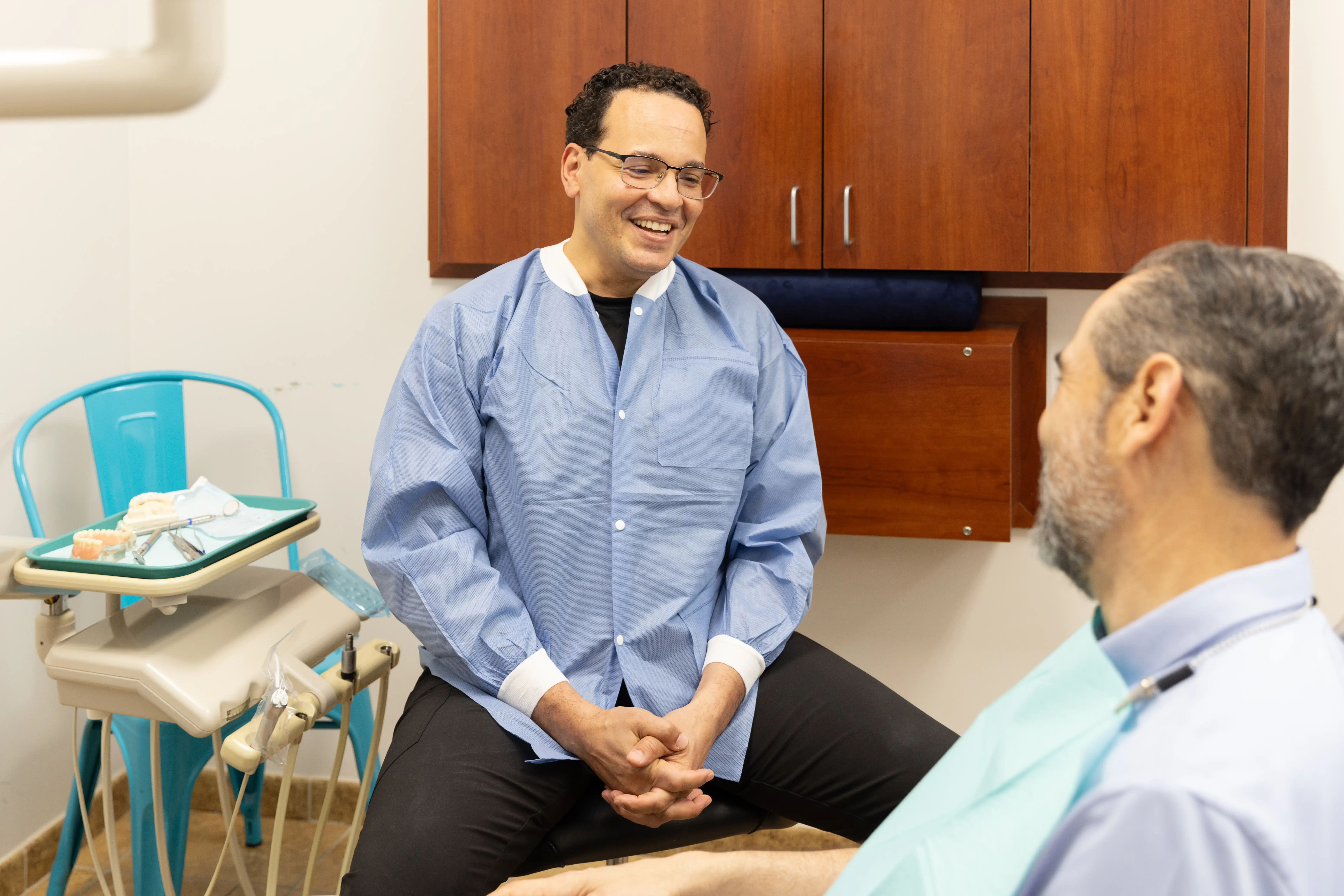 Dr. Rodriguez explaining dentures to a patient