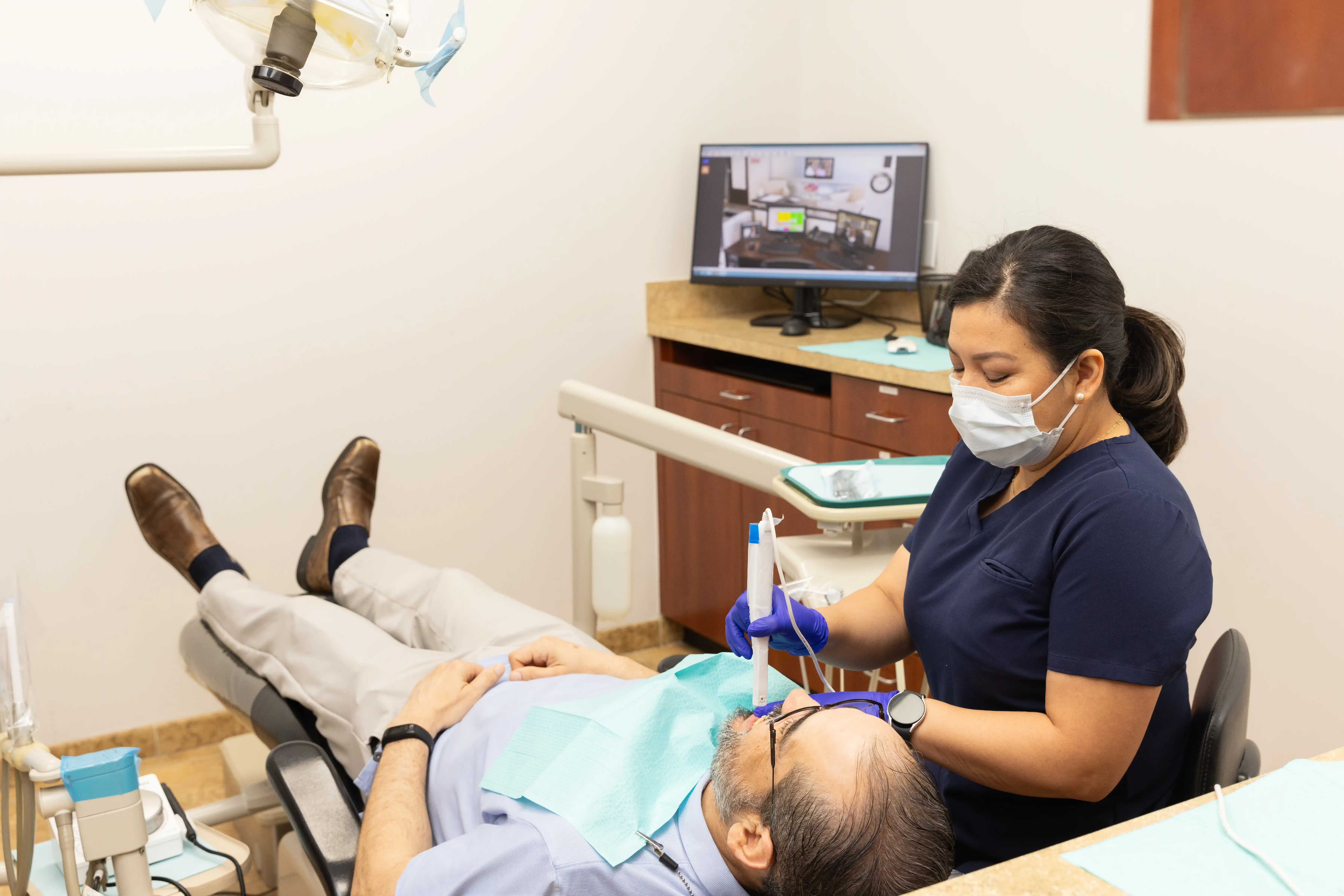Hygienist preparing patient for whitening